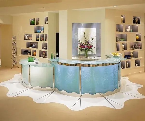 Curved reception desk with an illuminated bubble wall front in a spa