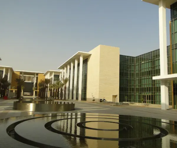 Concentric multi-ring reflection pools on a university campus plaza at KAUST