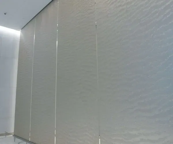 Multi-panel interior waterwall with a rippled, textured cascade surface