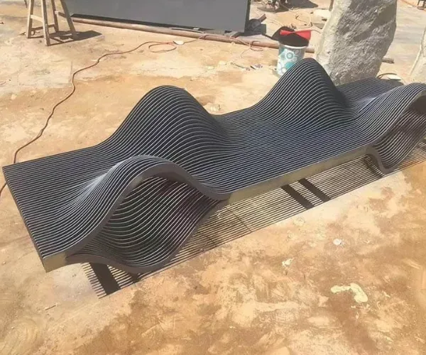 Parametric wave-form steel bench during installation