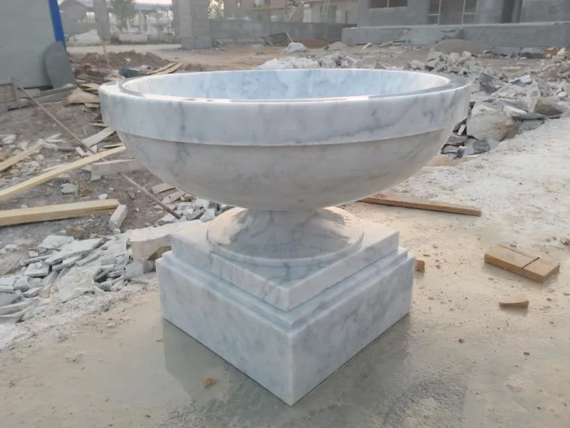 Carved stone planter urn