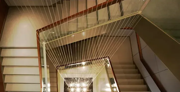 Rain curtain falling through a double-height atrium