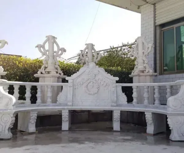 Carved white marble bench with balustraded back