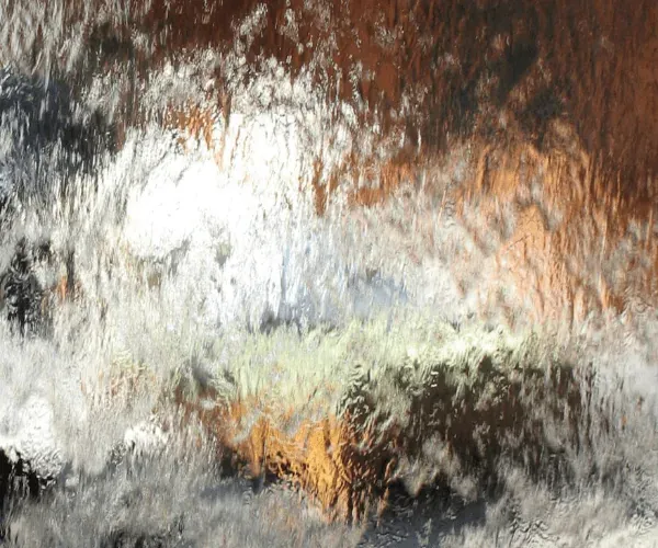 Water sheeting over a mirror-finish panel